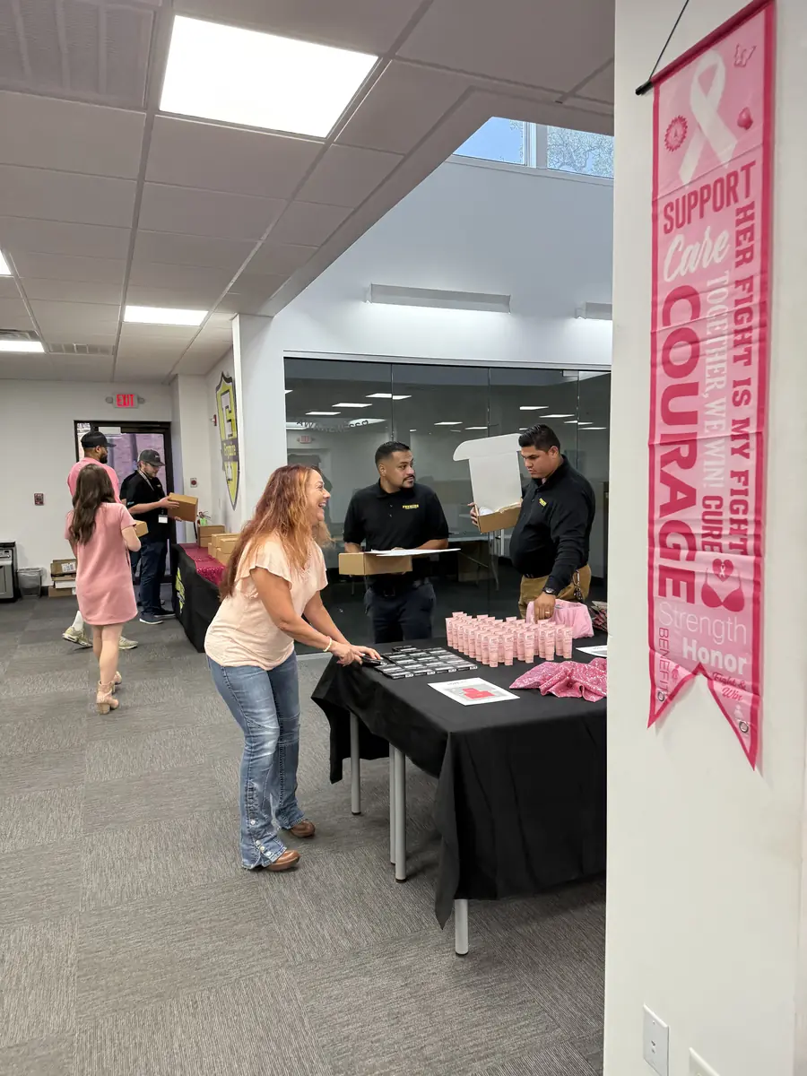 HOPE Kits packing line beside a pink banner reading This Fight Is My Fight, Courage