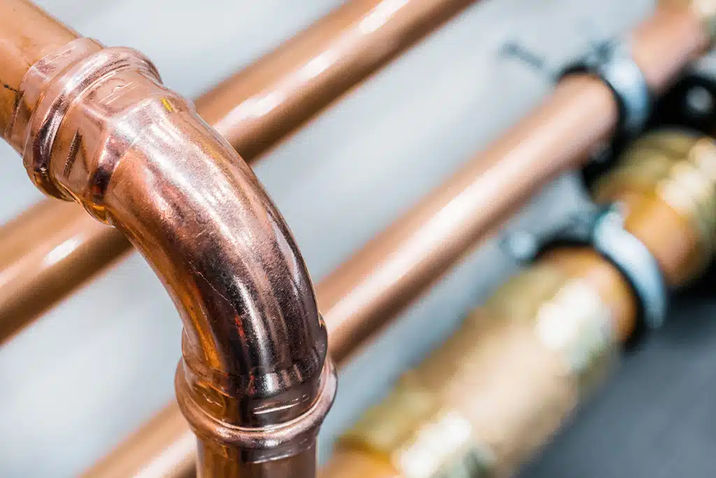 A close-up of a copper gas line