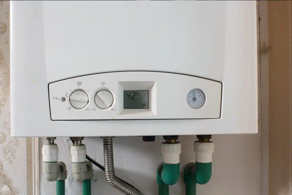 A white tankless water heater.