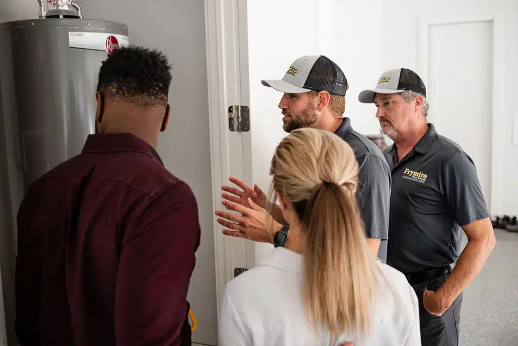 a man standing in front of a group of people looking at each other